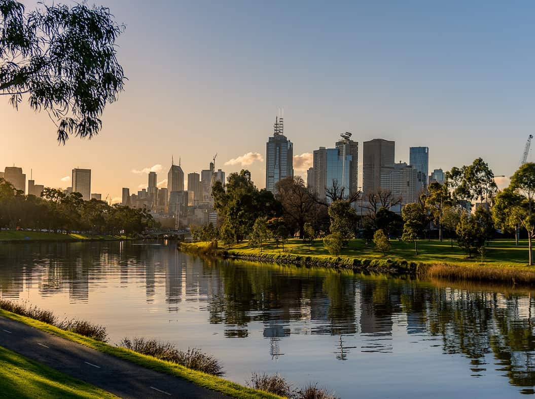 Melbourne cityscape with Yarra River at sunset.